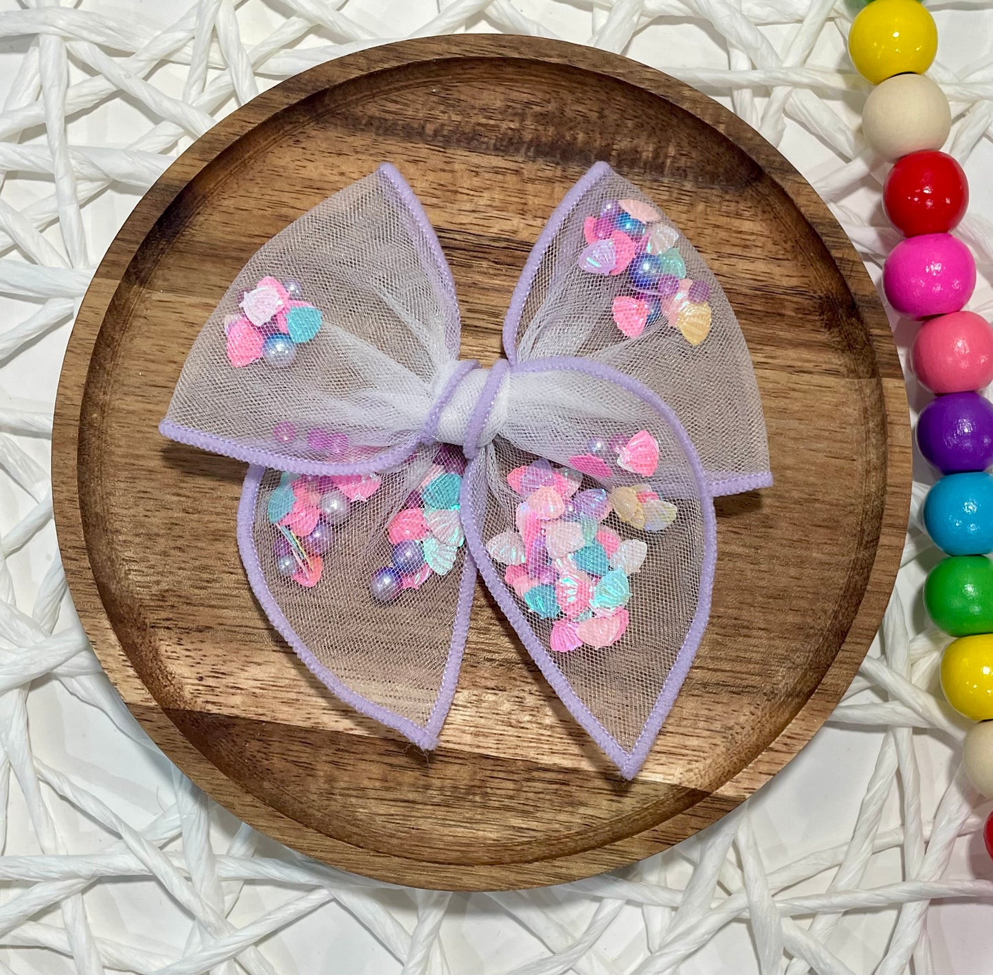 Colorful Seashells Purple Shaker Bow